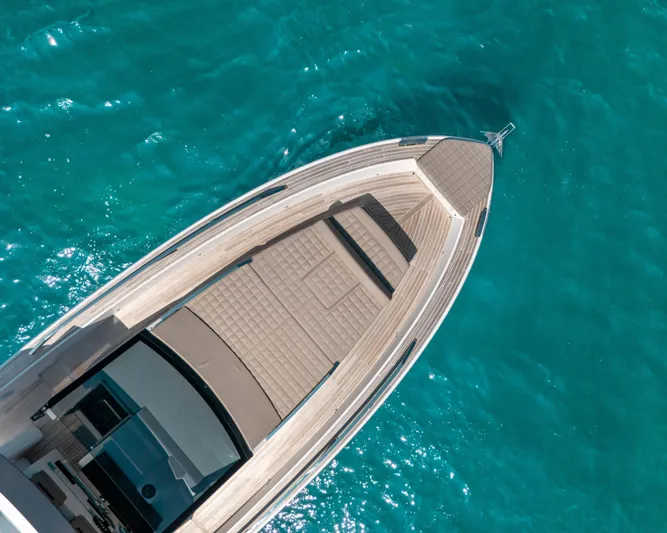  Yacht Photos Pics Aerial view of 2023 Fiart SEAWALKER 43 yacht on turquoise water.