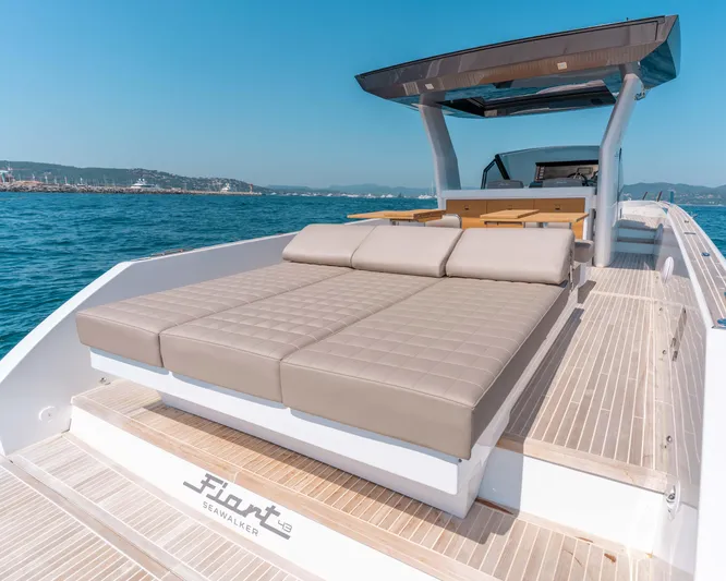  Yacht Photos Pics 2023 Fiart SEAWALKER 43 luxury yacht with sunbed, cruising on open water.