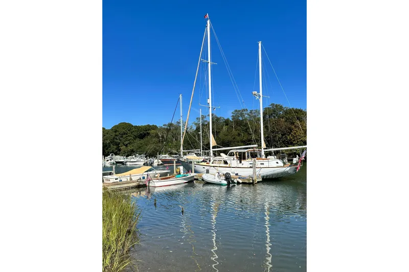 Scout (name Reserved) Yacht Photos Pics Sailboats docked in a serene marina, featuring a 1971 Alden Boothbay Explorer.