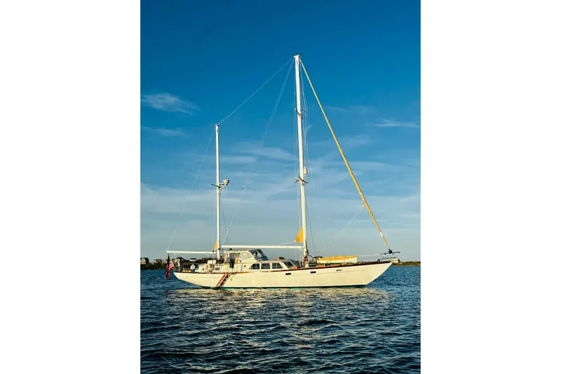 Scout (name Reserved) Yacht Photos Pics Sailboat Alden Boothbay Explorer 1971 on calm water under clear blue sky.