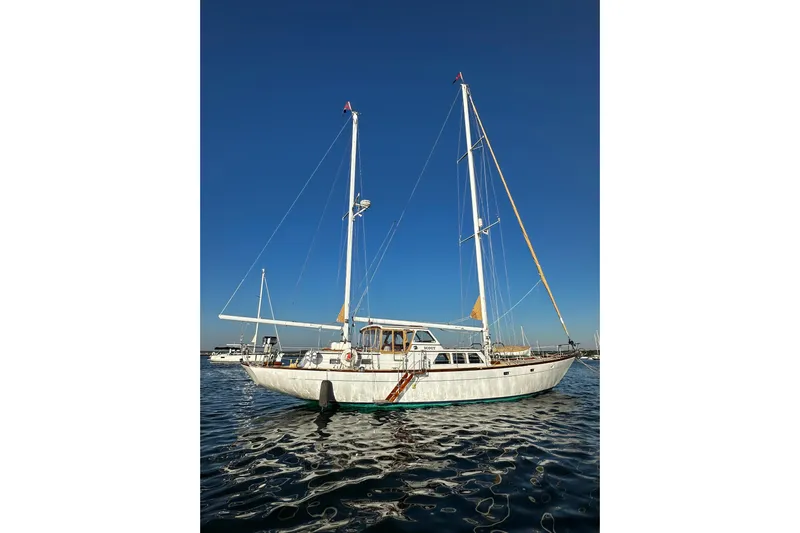 Scout (name Reserved) Yacht Photos Pics Sailboat on water, Alden Boothbay Explorer, 1971 model, under clear blue sky.
