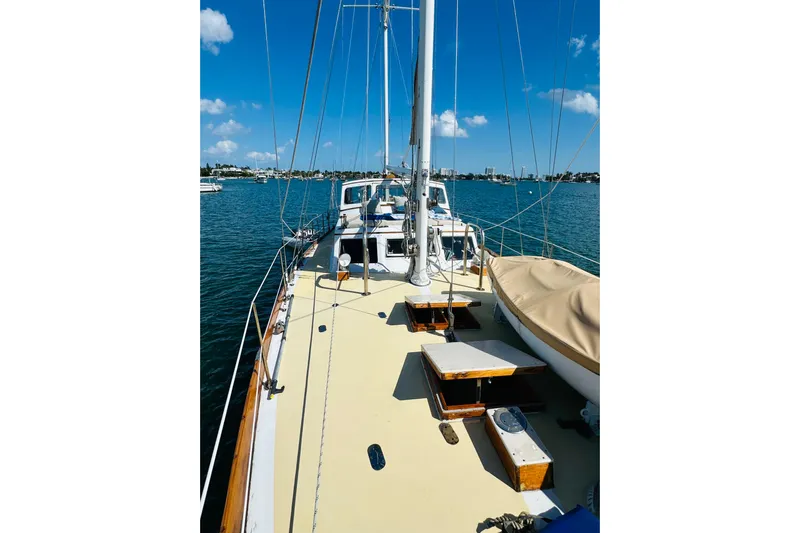Scout (name Reserved) Yacht Photos Pics 1971 Alden Boothbay Explorer sailboat on calm blue water under clear sky.
