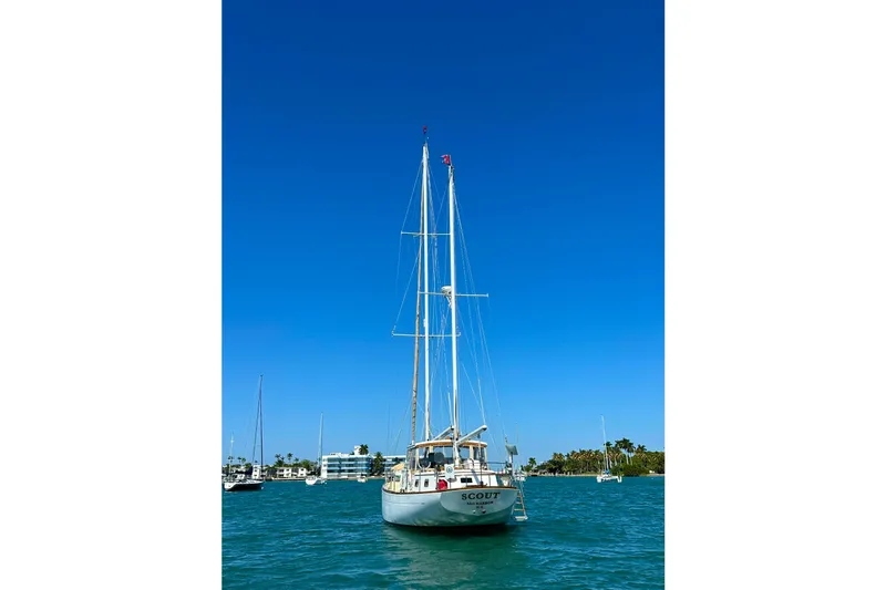Scout (name Reserved) Yacht Photos Pics Sailboat "Scout" on water, Alden Boothbay Explorer, 1971, under clear blue sky.