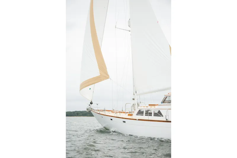 Scout (name Reserved) Yacht Photos Pics Sailing yacht Alden Boothbay Explorer 1971 on open water, white sails unfurled.