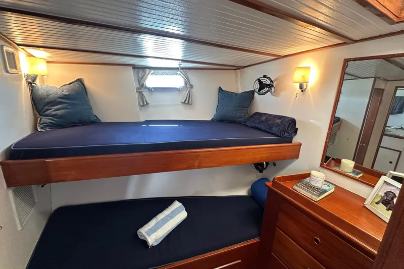 Scout (name Reserved) Yacht Photos Pics Cozy cabin interior of 1971 Alden Boothbay Explorer with bunk beds and nautical decor.