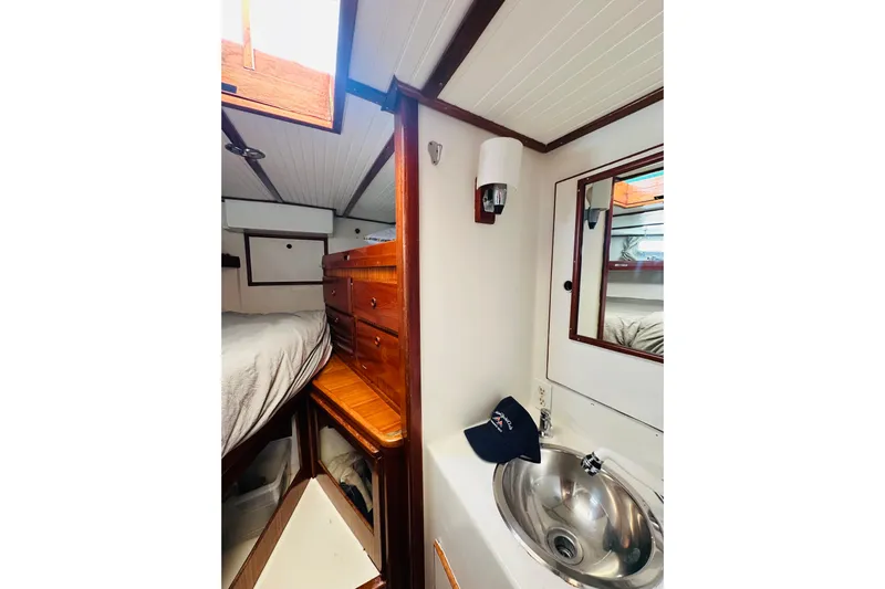Scout (name Reserved) Yacht Photos Pics 1971 Alden Boothbay Explorer interior with wooden cabinetry and compact sink area.