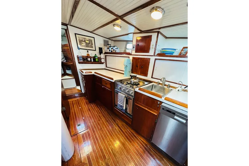 Scout (name Reserved) Yacht Photos Pics 1971 Alden Boothbay Explorer yacht kitchen with wood flooring and modern appliances.