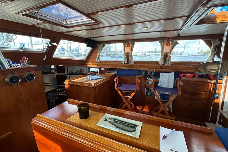 Scout (name Reserved) Yacht Photos Pics Interior of 1971 Alden Boothbay Explorer yacht with wooden furnishings and scenic windows.