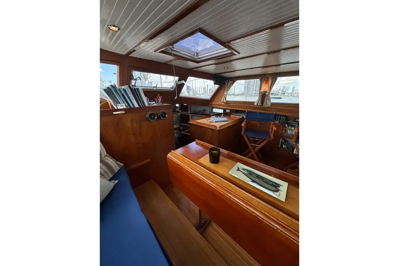 Scout (name Reserved) Yacht Photos Pics Interior of 1971 Alden Boothbay Explorer yacht with wooden furnishings and nautical decor.