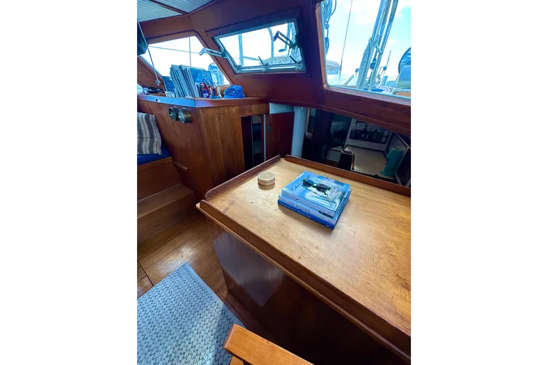 Scout (name Reserved) Yacht Photos Pics Interior of 1971 Alden Boothbay Explorer with wooden furnishings and nautical decor.