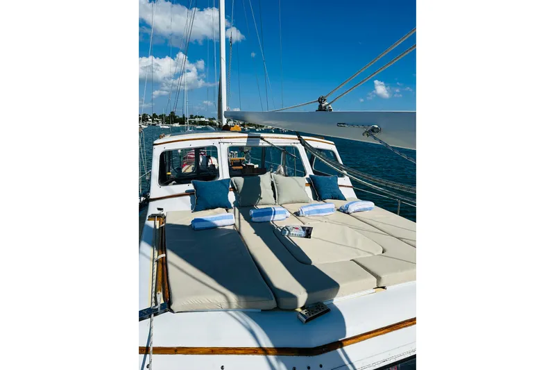 Scout (name Reserved) Yacht Photos Pics Alden Boothbay Explorer 1971 yacht with sunbathing deck, cushions, and towels on a sunny day.