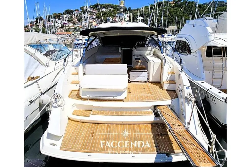  Yacht Photos Pics Luxury 2013 Azimut Atlantis 44 yacht docked in a marina, showcasing elegant design.