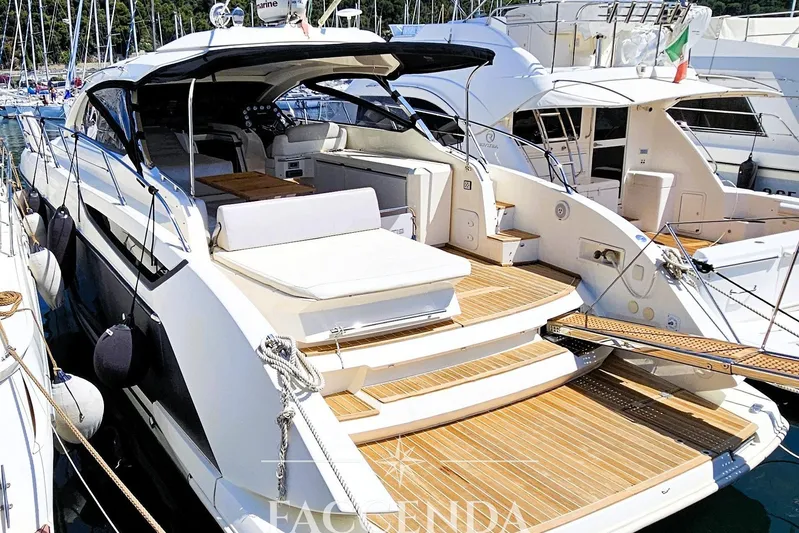  Yacht Photos Pics Luxurious 2013 Azimut Atlantis 44 yacht docked, featuring elegant design and spacious deck.