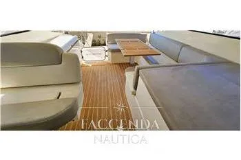  Yacht Photos Pics Interior view of 2013 Azimut Atlantis 44 yacht with seating and wooden flooring.