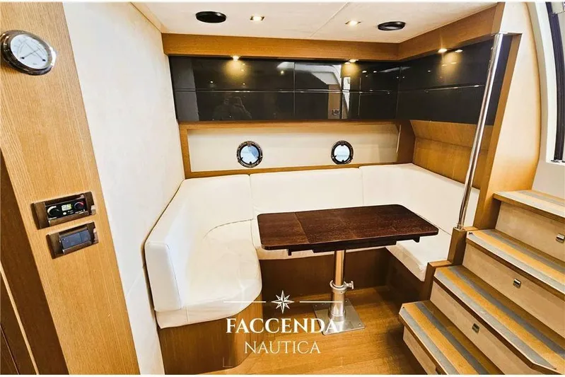  Yacht Photos Pics Luxurious interior of 2013 Azimut Atlantis 44 yacht with elegant seating and wooden table.