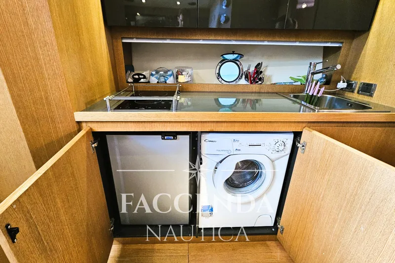  Yacht Photos Pics Compact kitchen area in 2013 Azimut Atlantis 44 yacht with appliances and storage.