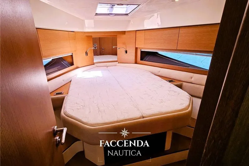  Yacht Photos Pics Luxurious interior of 2013 Azimut Atlantis 44 yacht cabin with elegant bedding.
