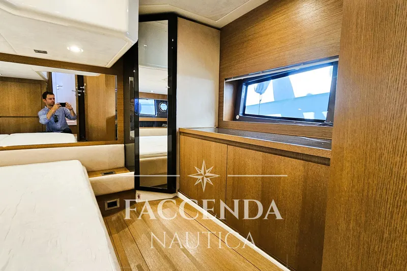  Yacht Photos Pics Interior of 2013 Azimut Atlantis 44 yacht with wooden finishes and window view.