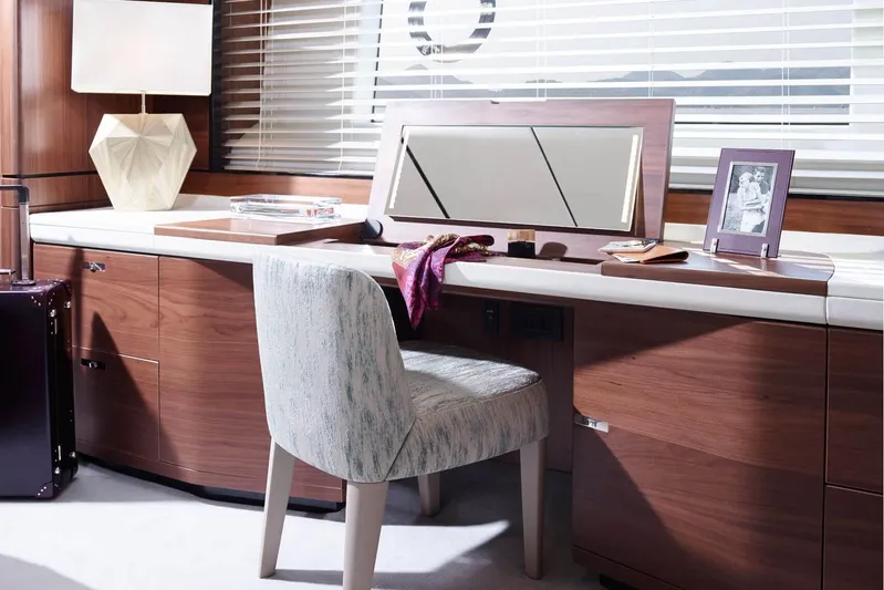  Yacht Photos Pics Luxurious yacht interior with wooden desk, chair, and decor on a Princess 75, 2016 model.