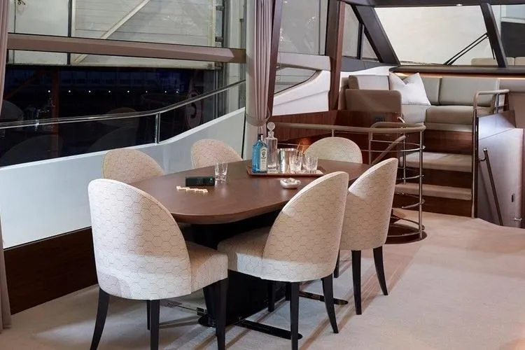  Yacht Photos Pics Luxurious interior of a 2016 Princess 75 yacht with elegant dining area.