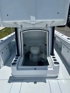  Yacht Photos Pics 2024 Yellowfin 32CC Offshore boat with open console showing marine toilet.