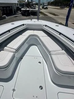  Yacht Photos Pics 2024 Yellowfin 32CC OFFSHORE boat with white cushioned seating and spacious deck.