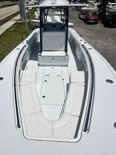  Yacht Photos Pics 2024 Yellowfin 32CC OFFSHORE boat, spacious deck view with seating and storage.