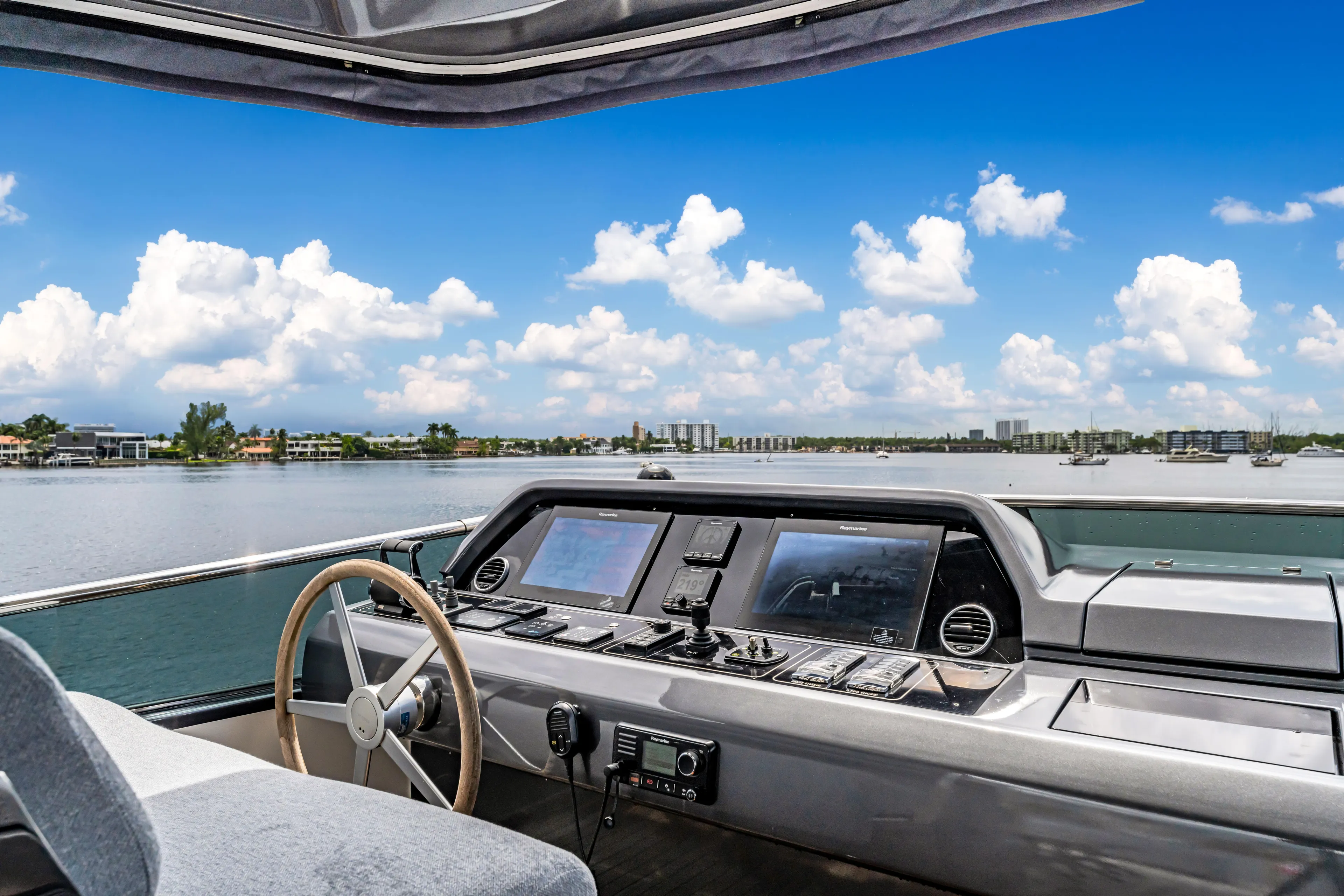 Sand Yacht Photos Pics Sanlorenzo SL78 2018 yacht helm with scenic water view and blue sky.