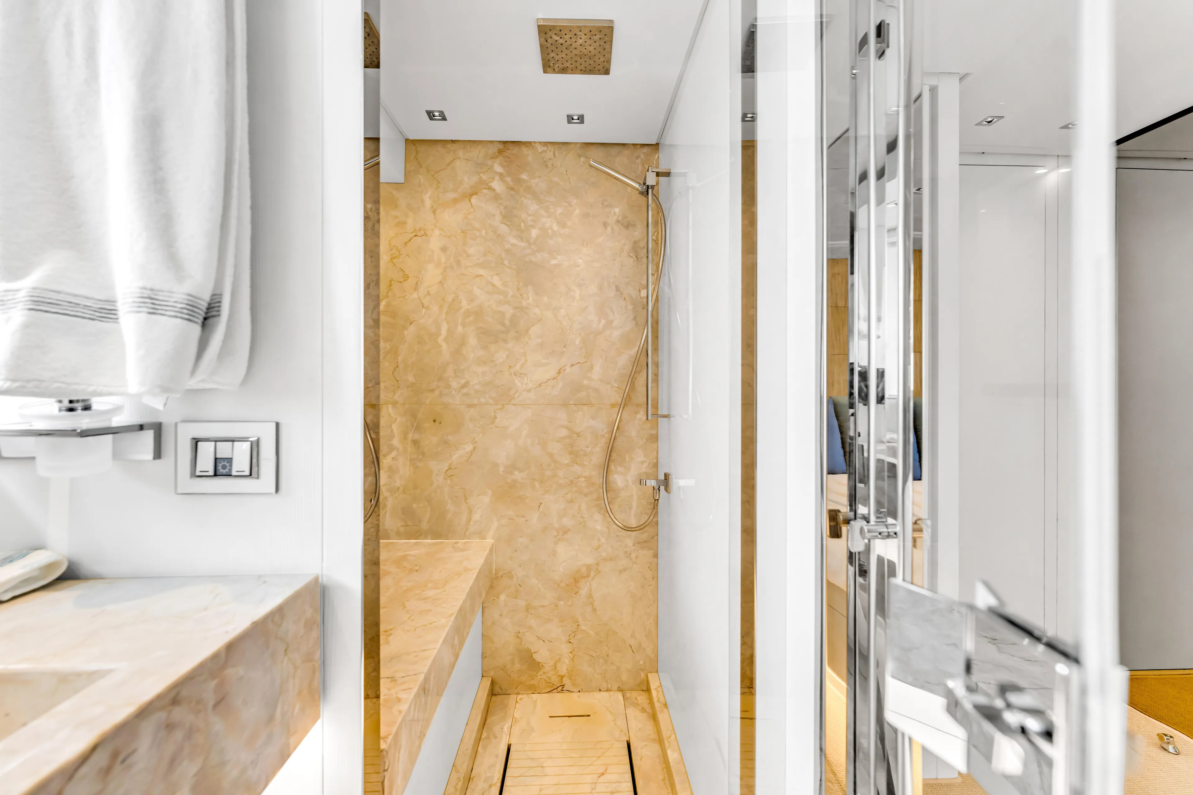 Sand Yacht Photos Pics Luxurious bathroom in 2018 Sanlorenzo SL78 yacht with marble shower and modern fixtures.