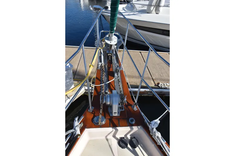 Shibumi Yacht Photos Pics Bow of 1995 Island Packet 37 sailboat with anchor chain and winch at dock.