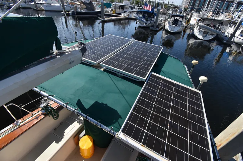 Shibumi Yacht Photos Pics Sailboat with solar panels docked at marina, Island Packet 37, 1995 model.