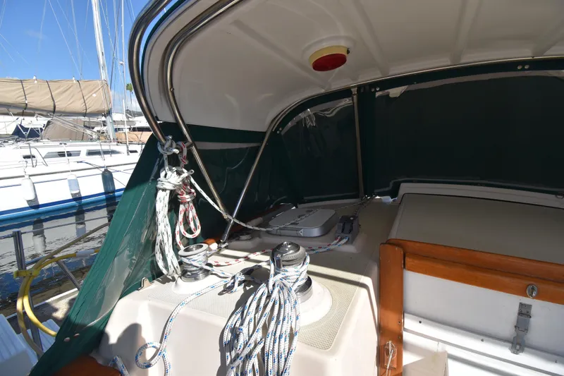 Shibumi Yacht Photos Pics 1995 Island Packet 37 sailboat cockpit with ropes and winches, docked at marina.