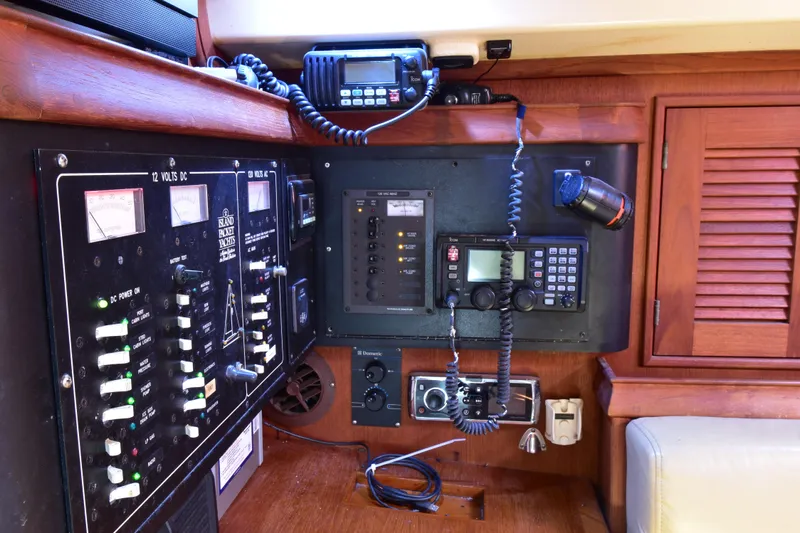 Shibumi Yacht Photos Pics Control panel of a 1995 Island Packet 37 yacht with navigation and communication equipment.
