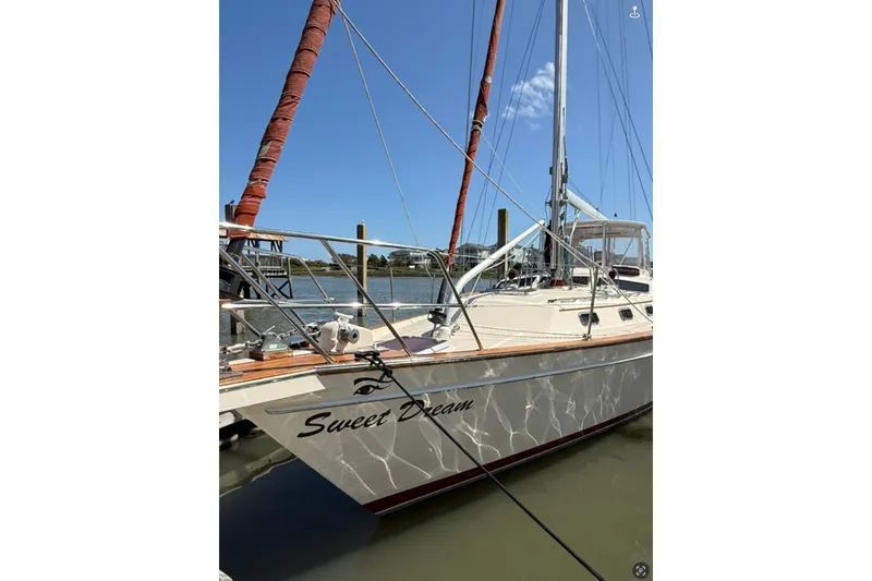 Sweet Dream Yacht Photos Pics 2005 Island Packet 485 sailboat named "Sweet Dream" docked in sunny marina.