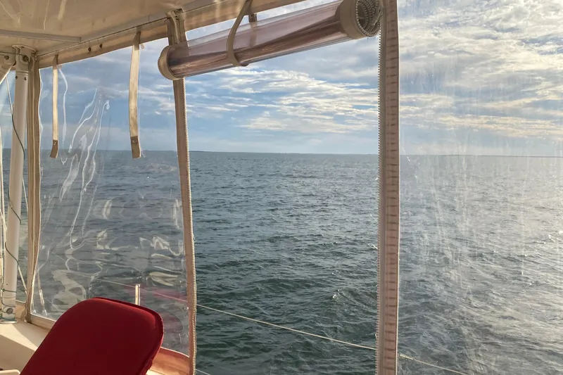 Sweet Dream Yacht Photos Pics View from 2005 Island Packet 485 sailboat, overlooking serene ocean and sky.