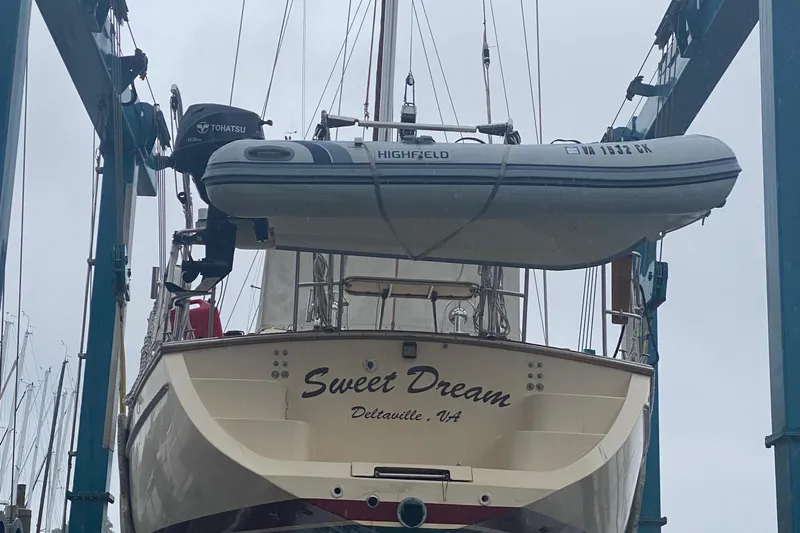 Sweet Dream Yacht Photos Pics Island Packet 485 sailboat from 2005 with dinghy, named "Sweet Dream," in Deltaville, VA.