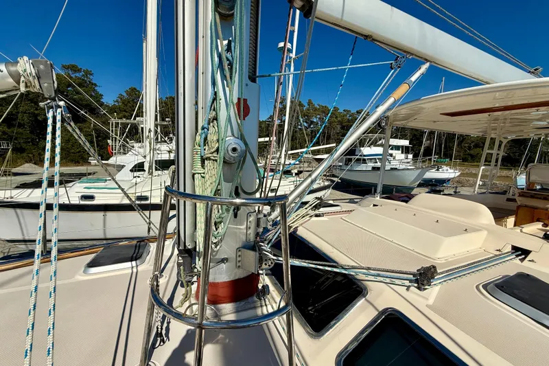 Sweet Dream Yacht Photos Pics 2005 Island Packet 485 sailboat deck with rigging and nearby boats in marina.