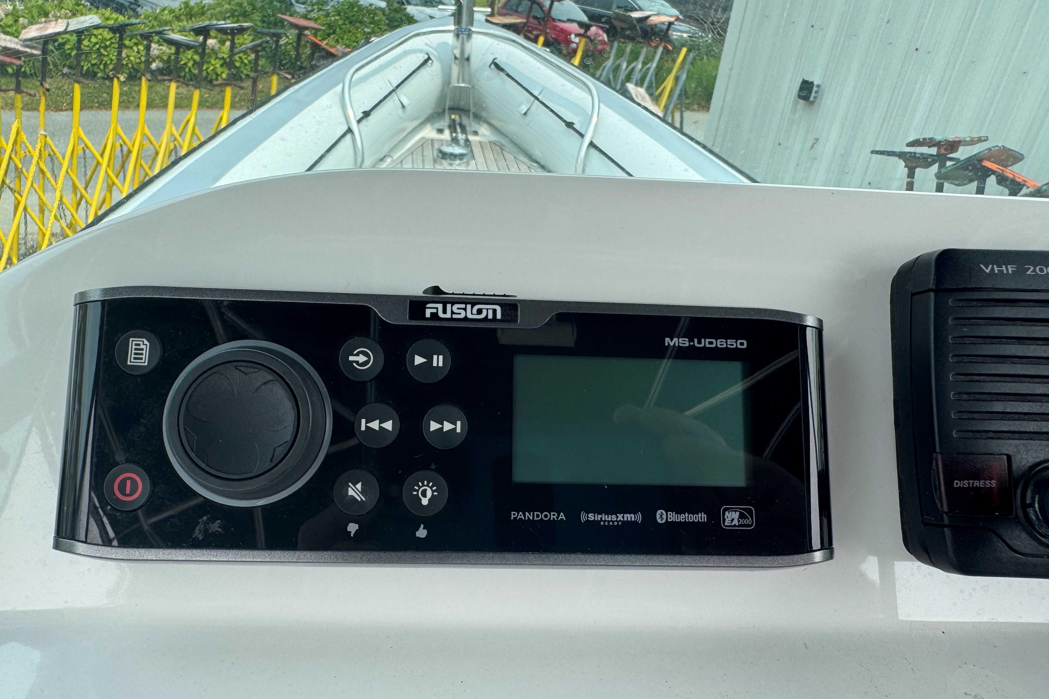 Control panel of a 2016 Protector 30 Center Console boat with Fusion MS-UD650 system.