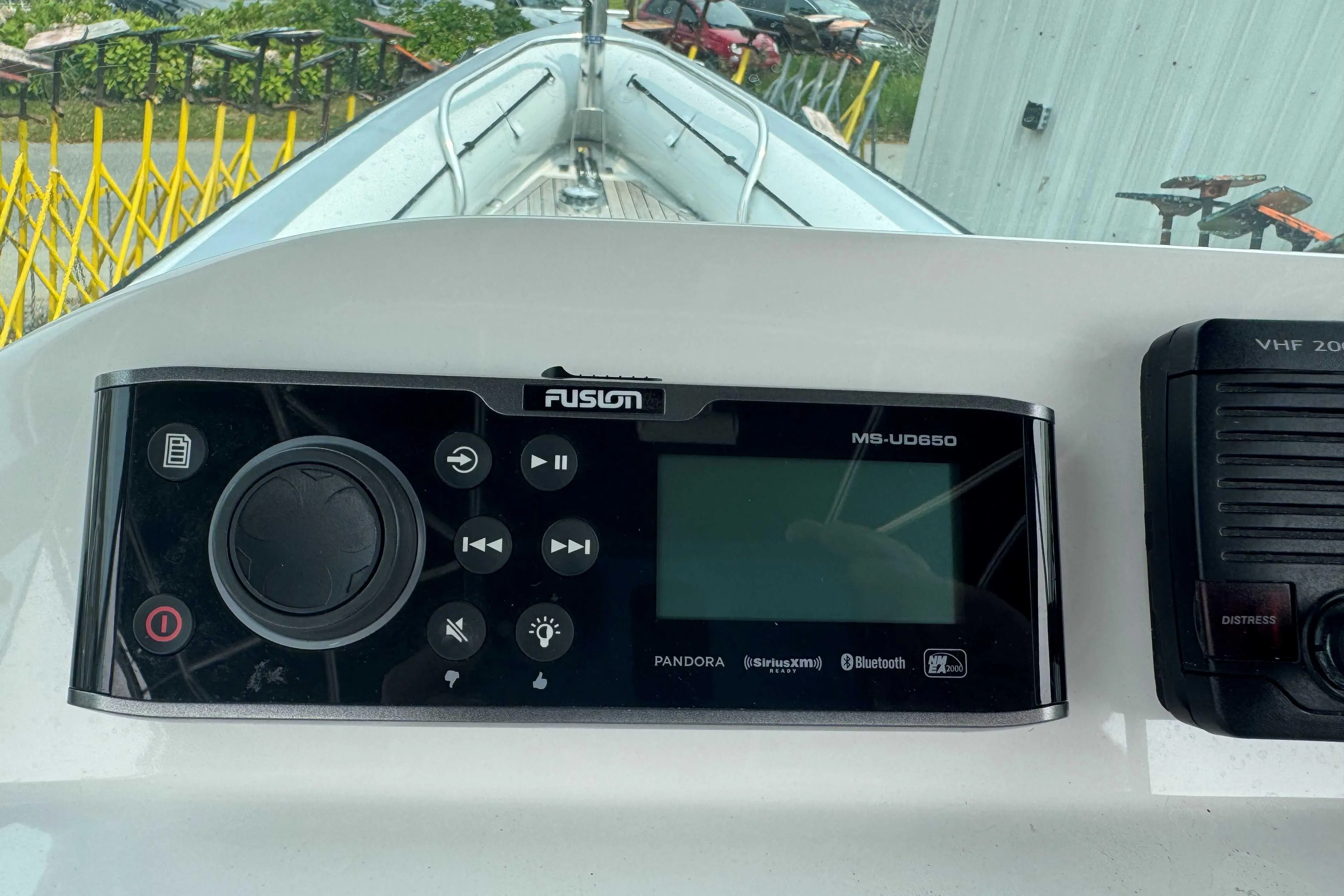 Control panel of a 2016 Protector 30 Center Console boat with Fusion MS-UD650 system.