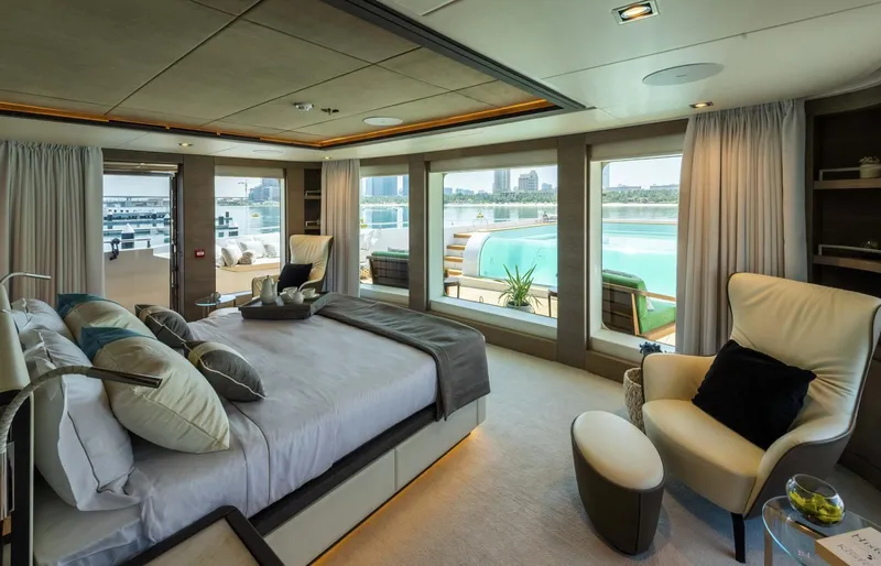 Available 2026 Yacht Photos Pics Luxurious bedroom on 2026 Majesty 175 yacht with panoramic ocean views.