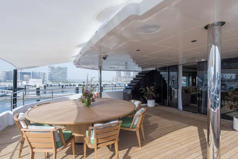 Available 2026 Yacht Photos Pics Luxurious 2026 Majesty 175 yacht deck with elegant outdoor dining area.