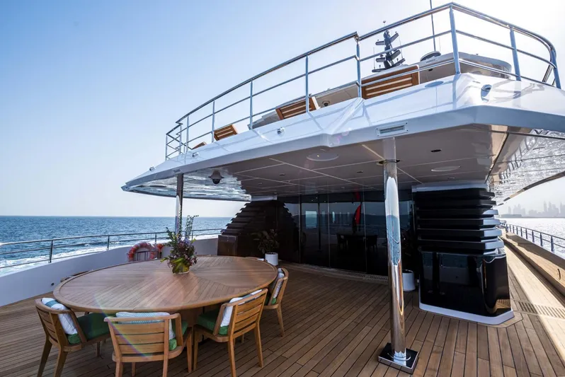 Available 2026 Yacht Photos Pics Luxurious 2026 Majesty 175 yacht deck with ocean view and elegant dining area.