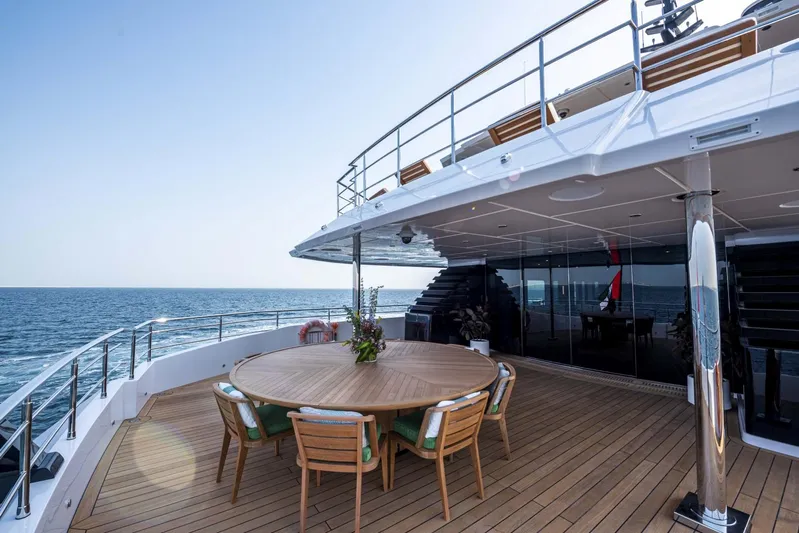 Available 2026 Yacht Photos Pics Luxurious 2026 Majesty 175 yacht deck with ocean view and elegant dining area.