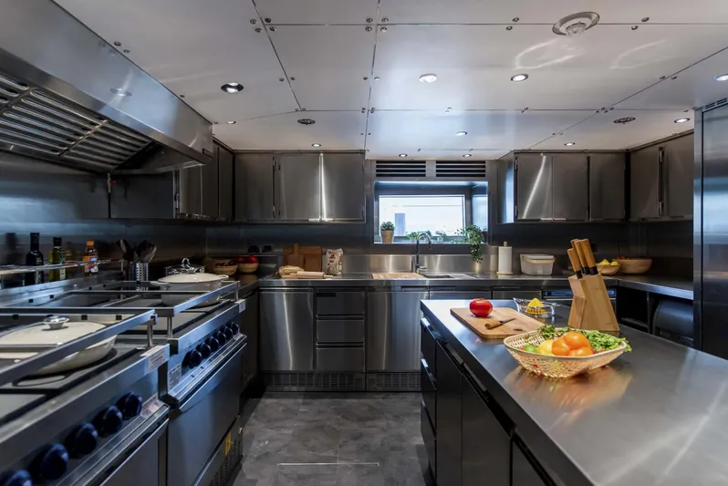 Available 2026 Yacht Photos Pics Modern stainless steel kitchen on 2026 Majesty 175 yacht, featuring sleek appliances and ample counter space.