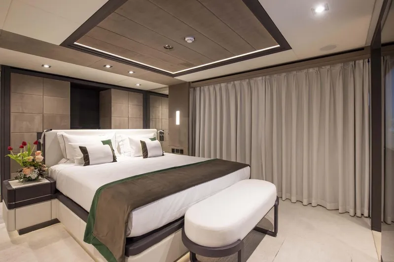Available 2026 Yacht Photos Pics Luxurious bedroom interior on 2026 Majesty 175 yacht, featuring elegant decor and modern furnishings.