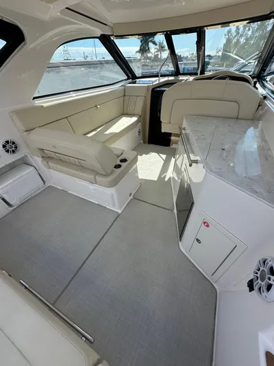  Yacht Photos Pics 2020 Regal 35 Sport Coupe interior with beige seating and modern design.