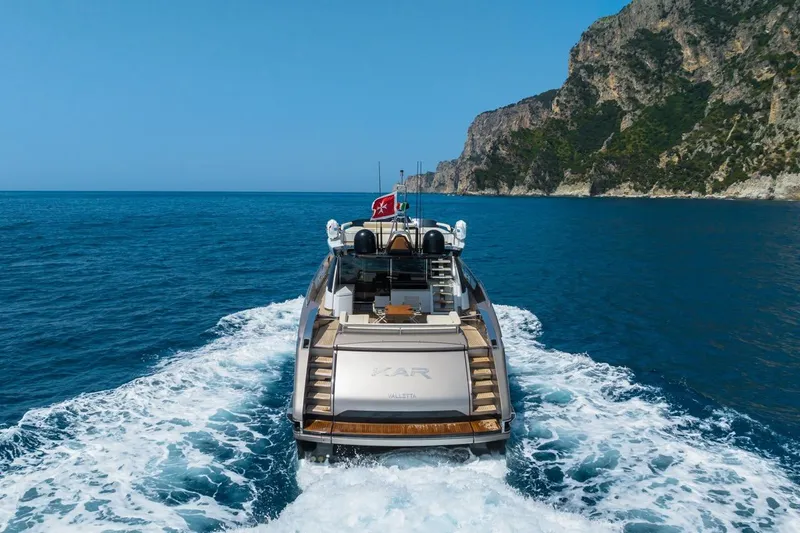 Kar Yacht Photos Pics Luxury Riva 88 Folgore yacht cruising near rocky coastline, 2021 model.
