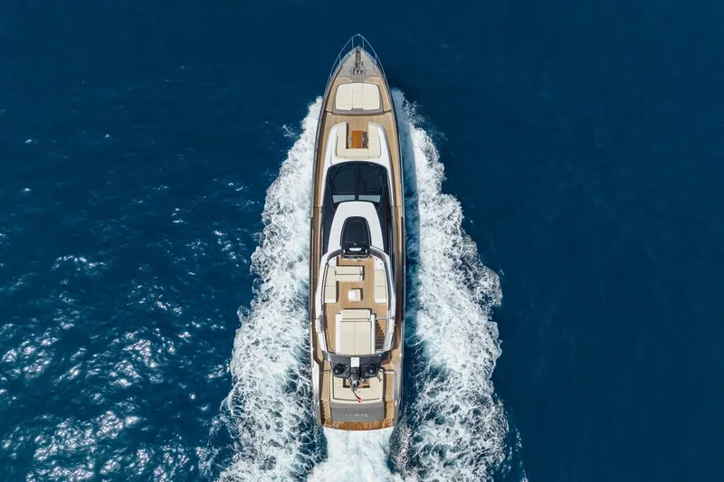 Kar Yacht Photos Pics Aerial view of 2021 Riva 88 Folgore yacht cruising on blue ocean waters.