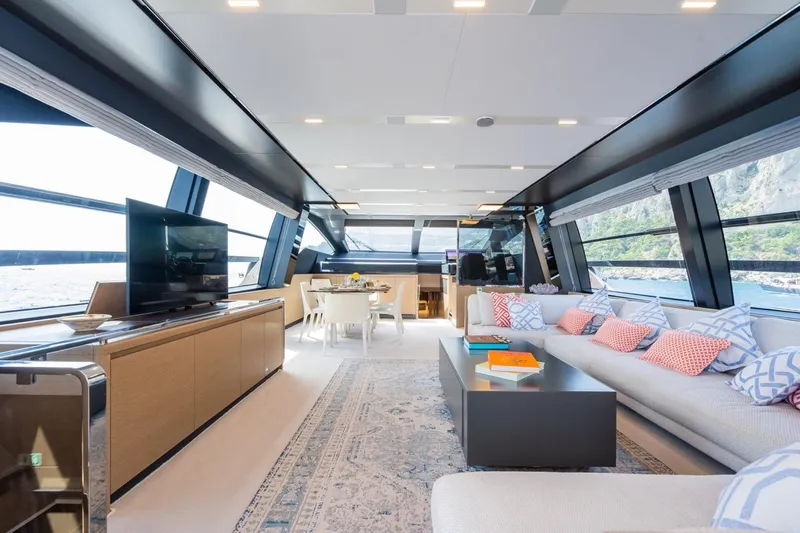 Kar Yacht Photos Pics Luxurious interior of 2021 Riva 88 Folgore yacht with modern decor and panoramic windows.