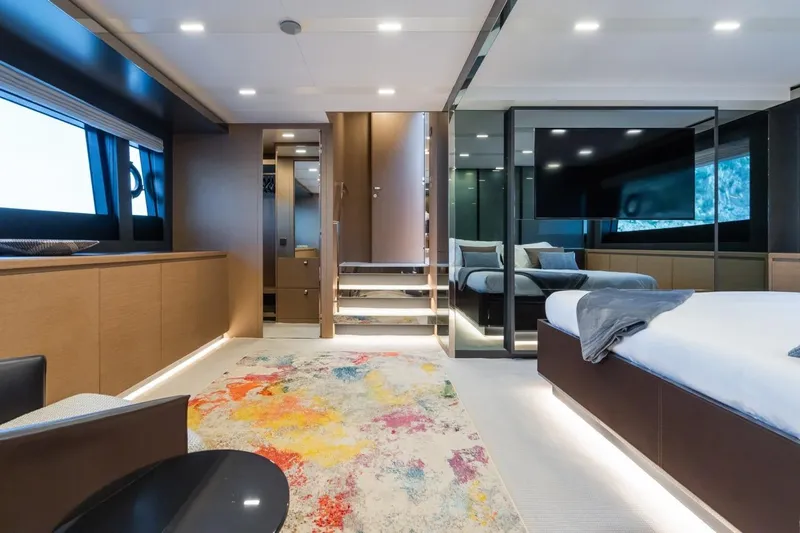 Kar Yacht Photos Pics Luxurious interior of 2021 Riva 88 Folgore yacht with modern design and vibrant rug.